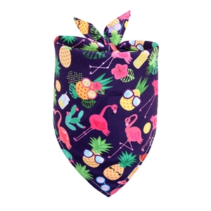 Detail of purple pet bandana with tropical flamingo, pineapple and cactus prints