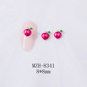 Detailed view of 8x8mm 3D hot pink peach nail charms with green leaves on a pink nail tip