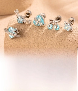 Detailed set of silver titanium steel cartilage studs with zircon stars and hearts