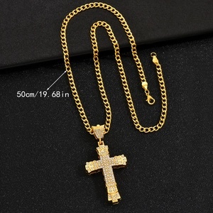 Detail view of a 50cm golden Cuban chain with a diamond-encrusted cross pendant