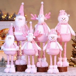 Detailed view of pink Christmas plush dolls including Santa, Reindeer, and Snowman in two sizes