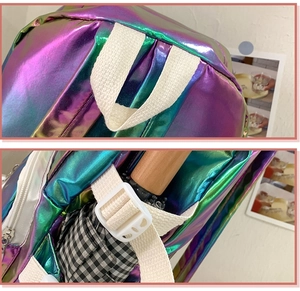 Detail of laser PU backpack with gradient metallic finish and white buckle strap