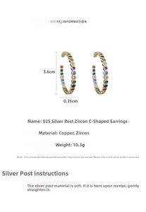 Detailed view of rainbow zircon C-shaped earrings with 3.6cm height and 925 silver needles