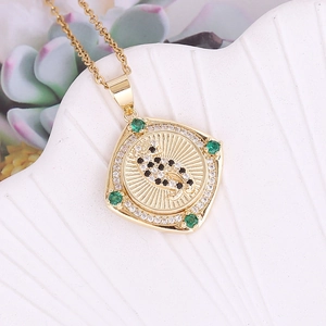 Rotating 18K gold leopard pendant necklace with sparkling zircons and green gemstones