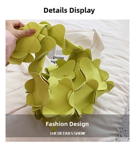 Macro detail of lime green 3D floral petals stitched on a designer PU leather handbag