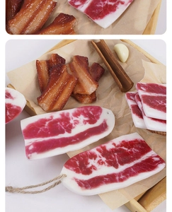 Detailed macro view of realistic PVC faux bacon prop with authentic meat texture