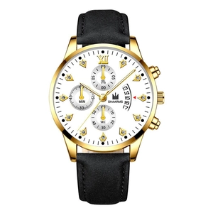 Detail of gold chronograph watch dial with Roman numerals, date window, and leather strap