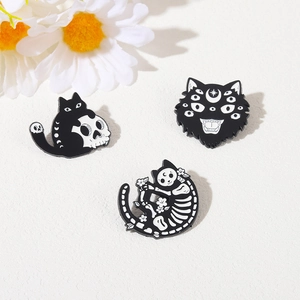 Set of three Gothic black cat skull enamel pins with moon symbols on white background