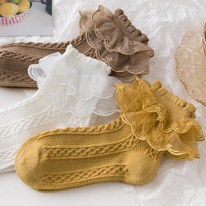 Three pairs of lace-trimmed cotton girls' socks in beige, brown, and yellow colors