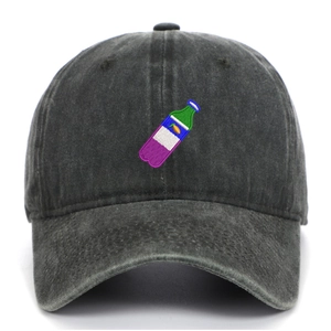 Close-up of vintage washed denim baseball cap featuring colorful bottle embroidery detail