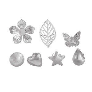Detail showing 7-piece silver ear cuff set with flower, star and heart shapes