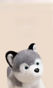 Close-up of realistic plush husky toy featuring grey and white fur and blue eyes