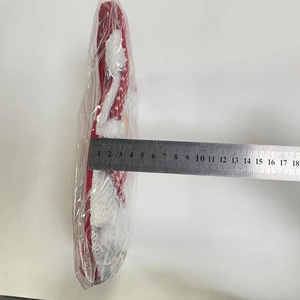 Detailed view showing a 17cm Christmas gift bag length measured with a metal ruler