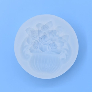 White silicone flower basket mold for DIY cake fondant and chocolate making on blue background