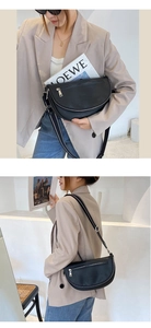 Front and side view of a black leather crossbody bag with adjustable strap worn by a model