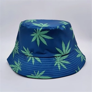 Detail view of navy blue bucket hat with lime green leaf print and reinforced stitching