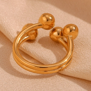 18K gold plated stainless steel open ring with dual spheres on textured fabric