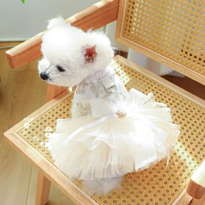Detail of luxury dog wedding dress with lace embroidery, pearl bow and metal D-ring