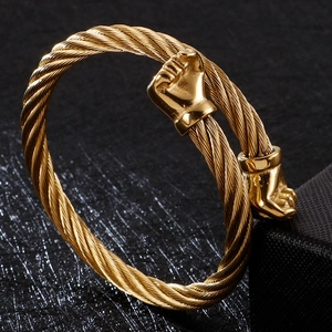 Golden titanium steel cable bracelet featuring detailed fist-shaped ends for men