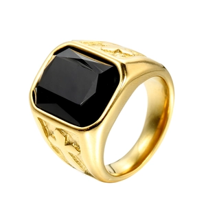 Detailed close-up of a men's gold titanium steel ring with a square black gemstone