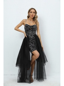 Detail of sequined bodice and detachable tulle train on a black party dress