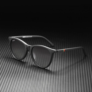 Detail of matte black sunglasses with iconic red-green stripe on the temple and logo