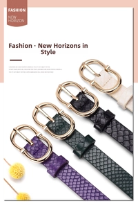 Detail of multi-color snakeskin embossed belts with elegant gold oval buckles