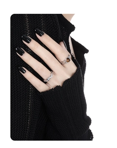 Close-up of S925 silver irregular hollow rings with tiger eye stone on model fingers