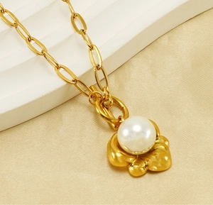 Detailed close-up of 18K gold-plated OT buckle necklace with flower pearl pendant