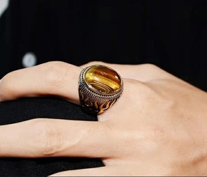 Retro men's silver ring with large oval tiger eye stone and golden flame relief