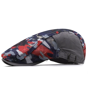 Close-up of camouflage mesh flat cap showing the metal buckle and breathable texture