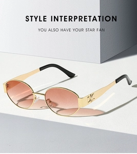 Detail of metal temple with embossed triomphe logo on gradient oval sunglasses