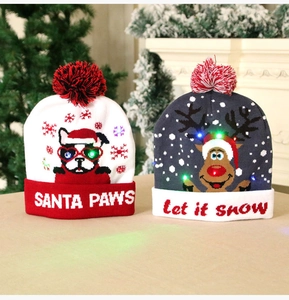 Detail of festive LED knitted Christmas hats featuring reindeer and bulldog patterns