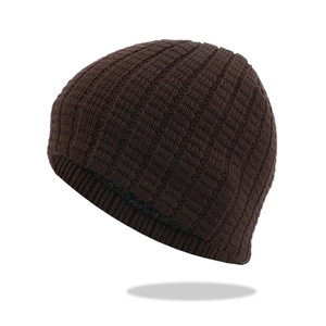 Deep brown winter knit beanie with thick ribbed texture and warm fleece lining
