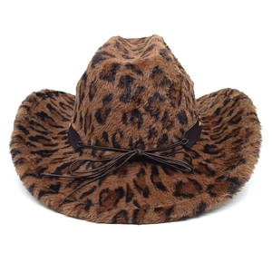 Detail of plush leopard print cowboy hat with brown cord trim and soft faux fur texture