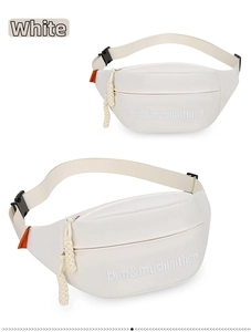 Detail of white canvas crossbody bag with orange fashion tag and embroidered letters