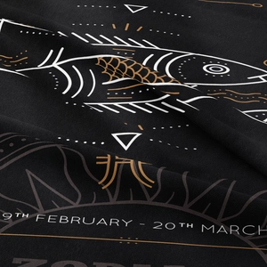 Macro detail of Pisces zodiac tapestry featuring geometric art on premium black textile