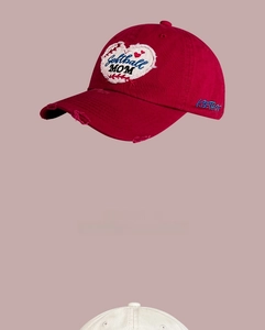 Detail of vintage burgundy softball mom hat with heart embroidery and distressed brim