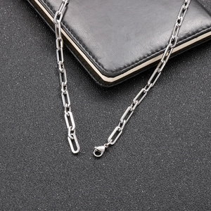 Close-up of chunky stainless steel rectangular link chain with secure lobster clasp