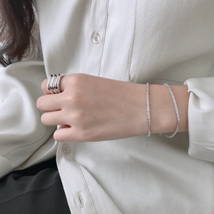 Minimalist S925 sterling silver sparkling chain bracelet and wavy ring on model hand