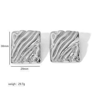 Detail view of silver rectangular earrings with wave texture, 38mm height and 29mm width