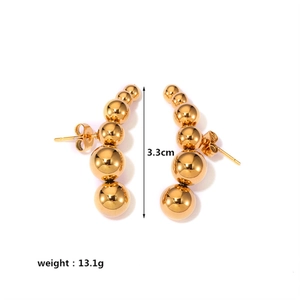 Detailed view of gold ball earrings with 3.3cm height scale and 13.1g weight display