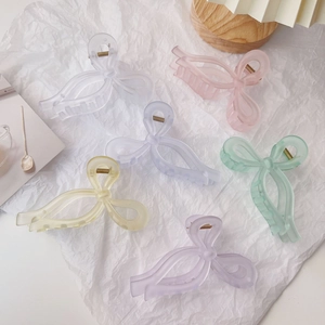 Set of six large matte acrylic bow claw clips in soft pastel colors for thick hair
