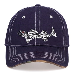 Detail of navy blue baseball cap featuring white fishbone embroidery and camouflage brim