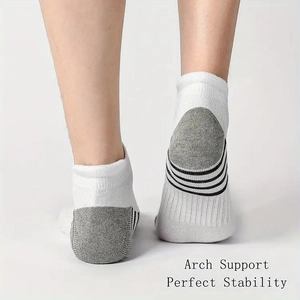 Detail of breathable athletic low cut socks with arch support and mesh knit texture