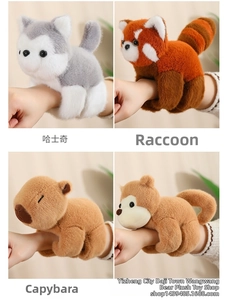 Detail view of four plush animal wristbands including raccoon, husky and capybara