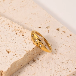 French vintage titanium steel gold ring with three white zircons on beige stone