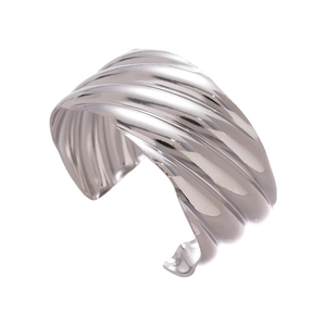 Polished silver wide open bangle featuring distinctive wavy geometric textures and metallic sheen
