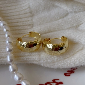Minimalist 925 sterling silver chunky gold hoops with irregular hammered texture surface