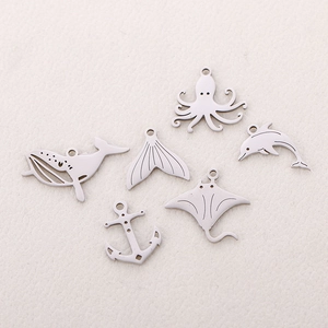 Polished stainless steel ocean charms set featuring whale, dolphin, octopus and anchor
